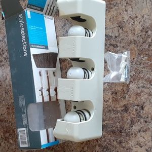 Broom and mop organizer